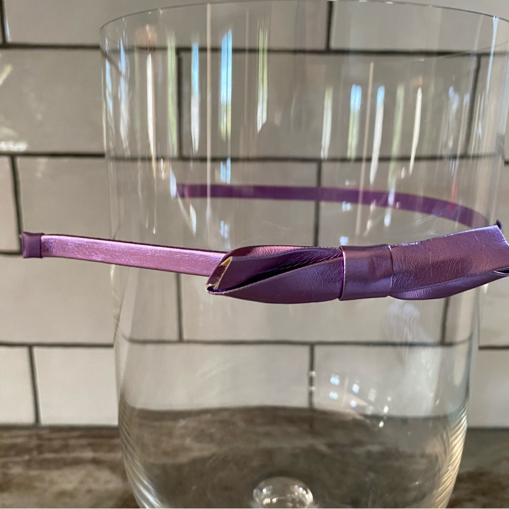 Thin purple headband with small bow